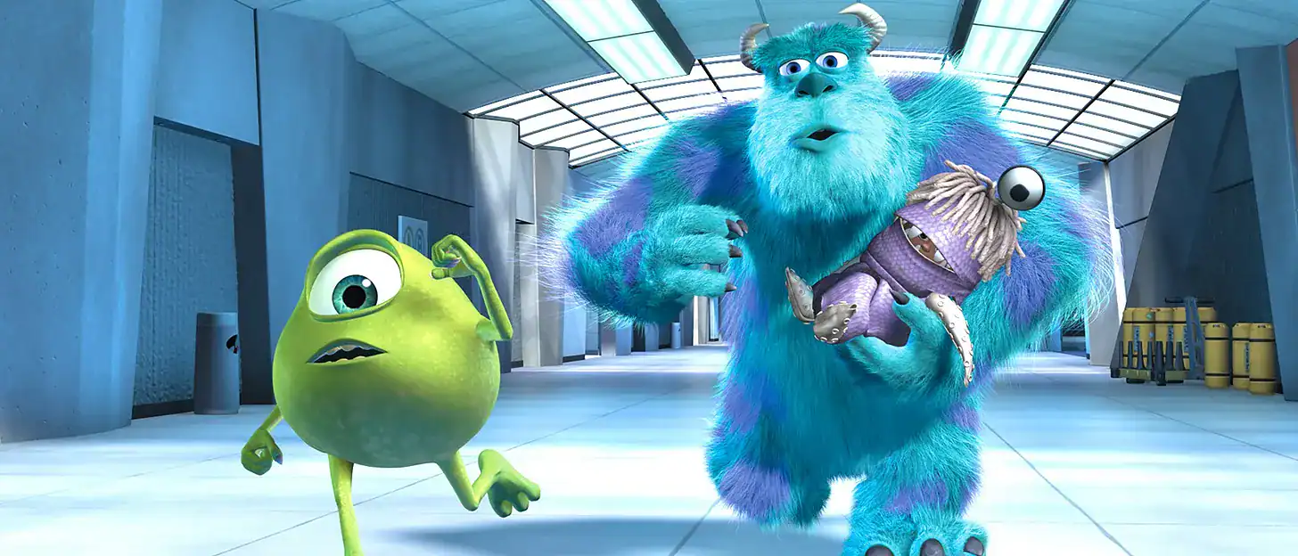 Animated monsters from Monsters Inc in a futuristic corridor.