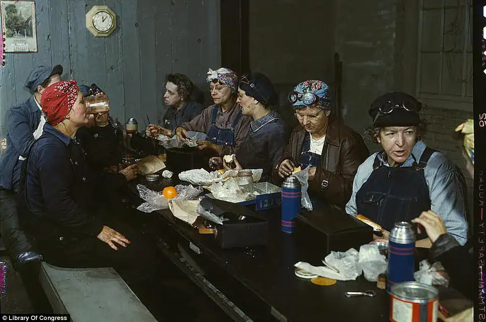 Women gathered around a table enjoying a meal together in a cozy setting.