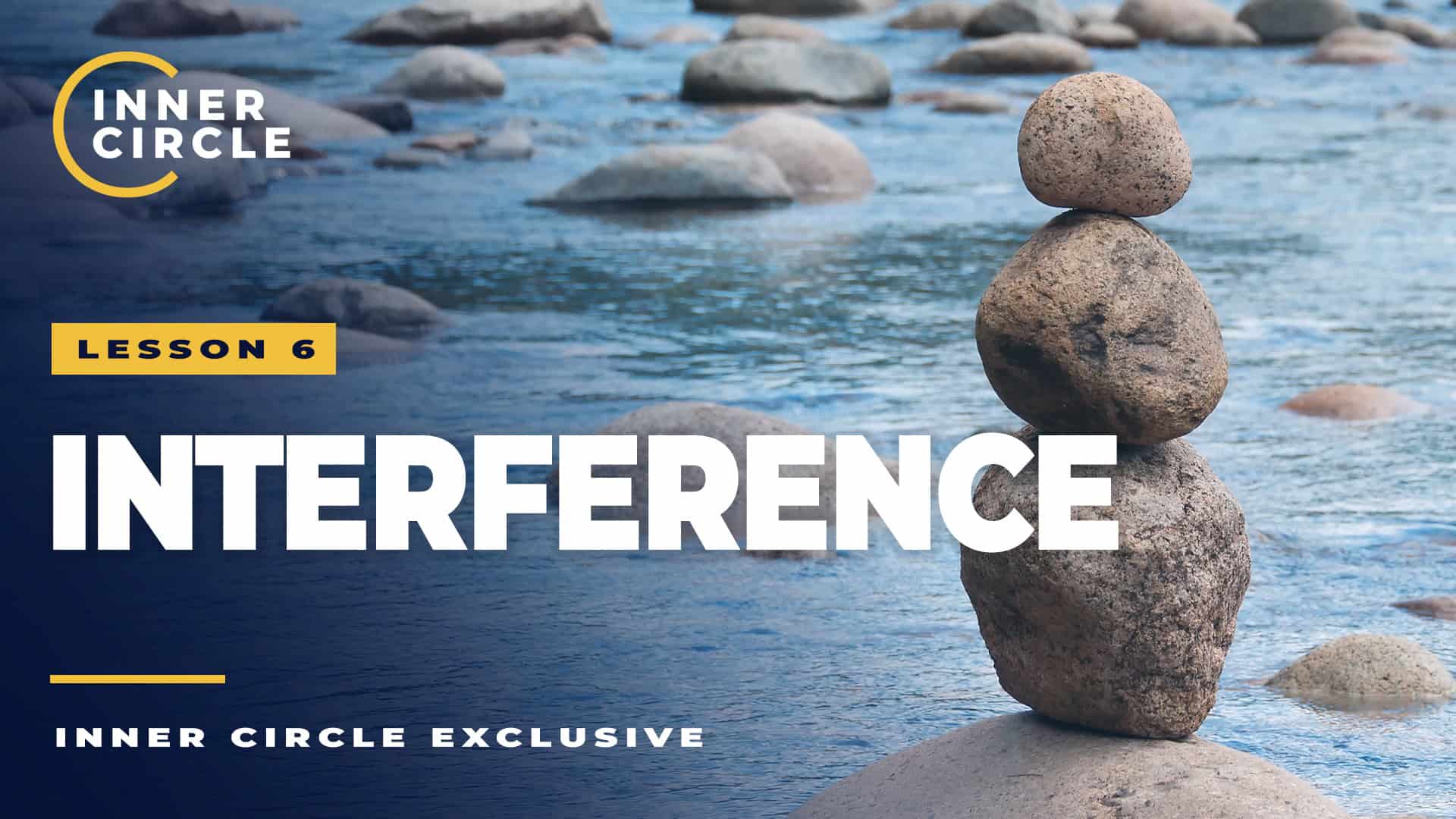 Stacked rocks on a river with water flowing around them, symbolizing interference.